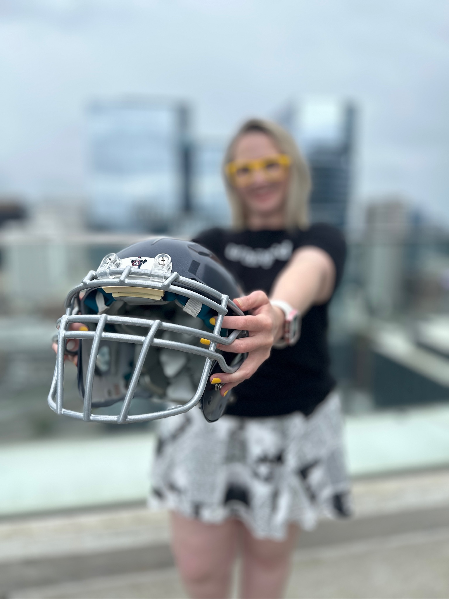 Kabrina Holding Football Helmet