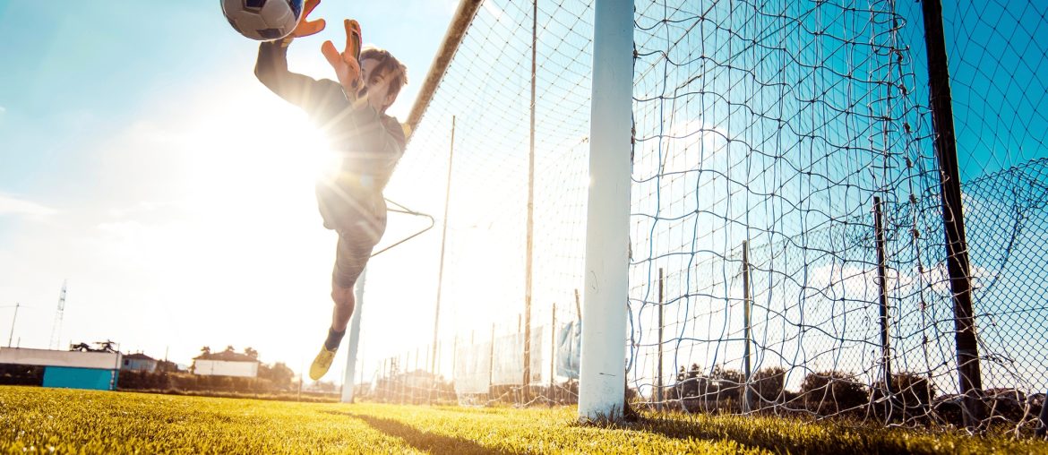Soccer player in action on the soccer stadium