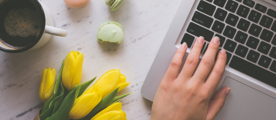 Woman hands typing on laptop